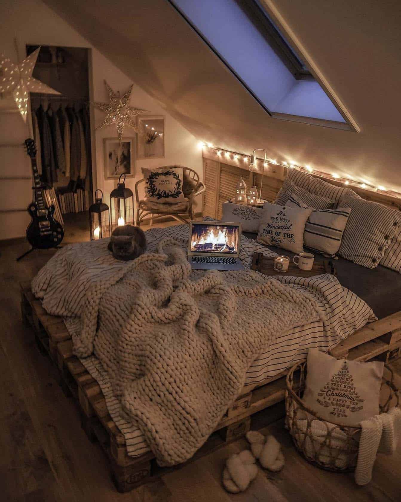 scandinavian inspired christmas bedroom with string lights