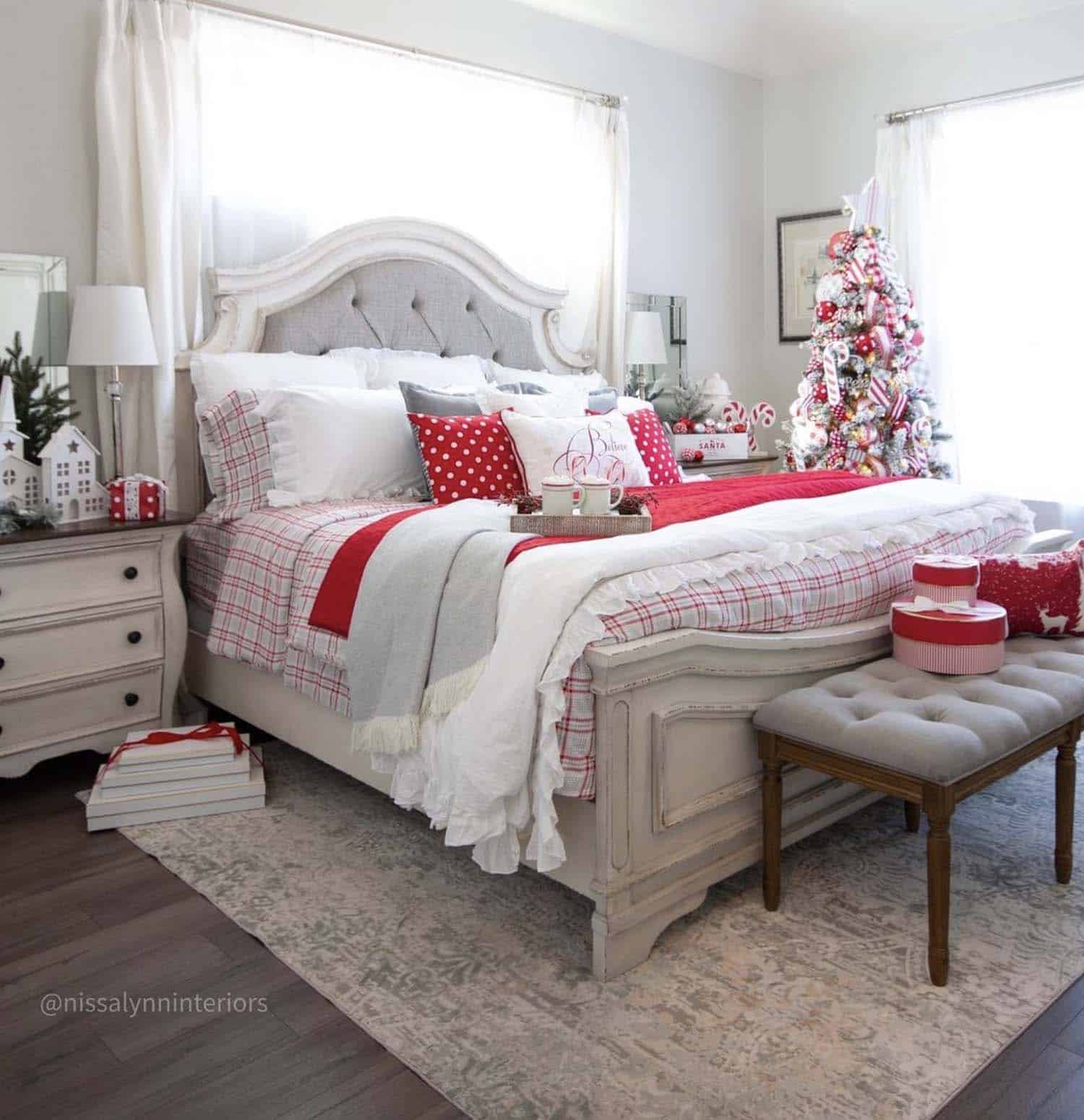festive and cozy christmas bedroom with a red and white color palette