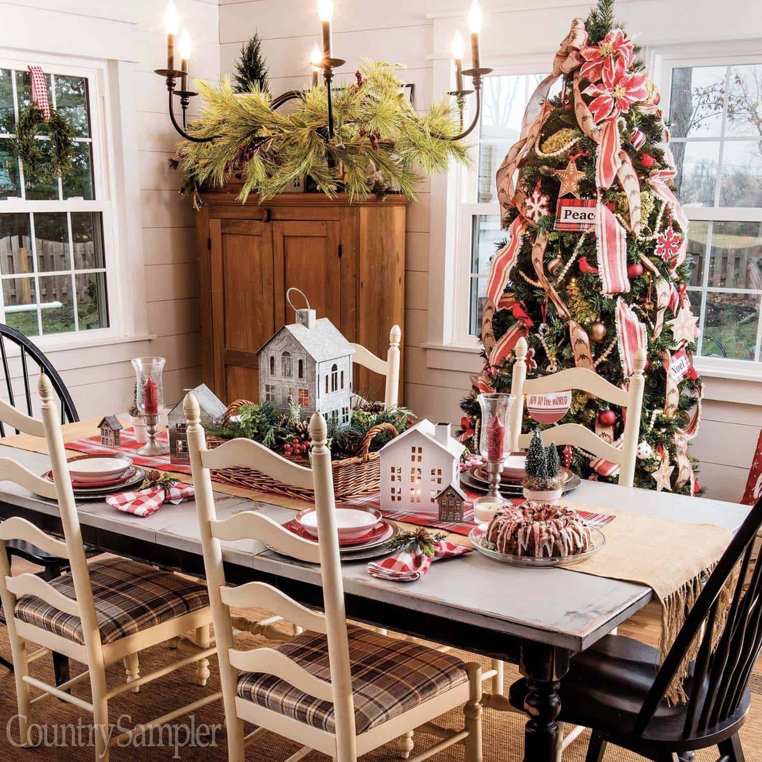 rustic dining table decor with christmas houses as the centerpiece