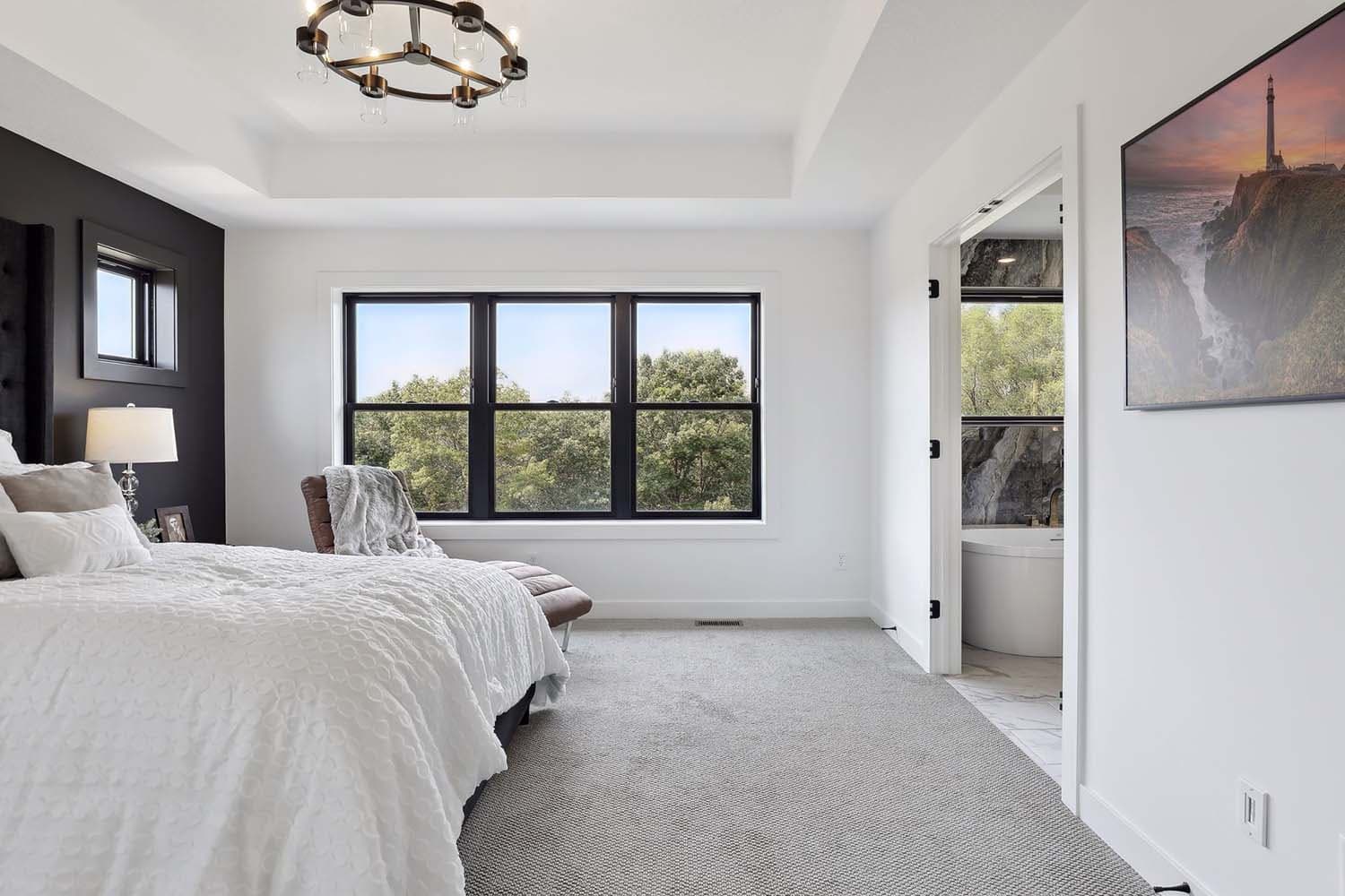 contemporary bedroom with large windows
