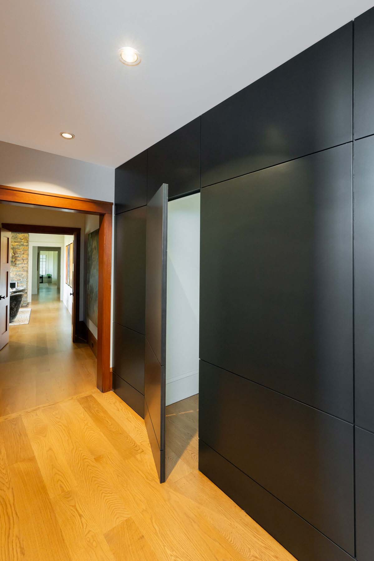 contemporary craftsman style hallway with a hidden door