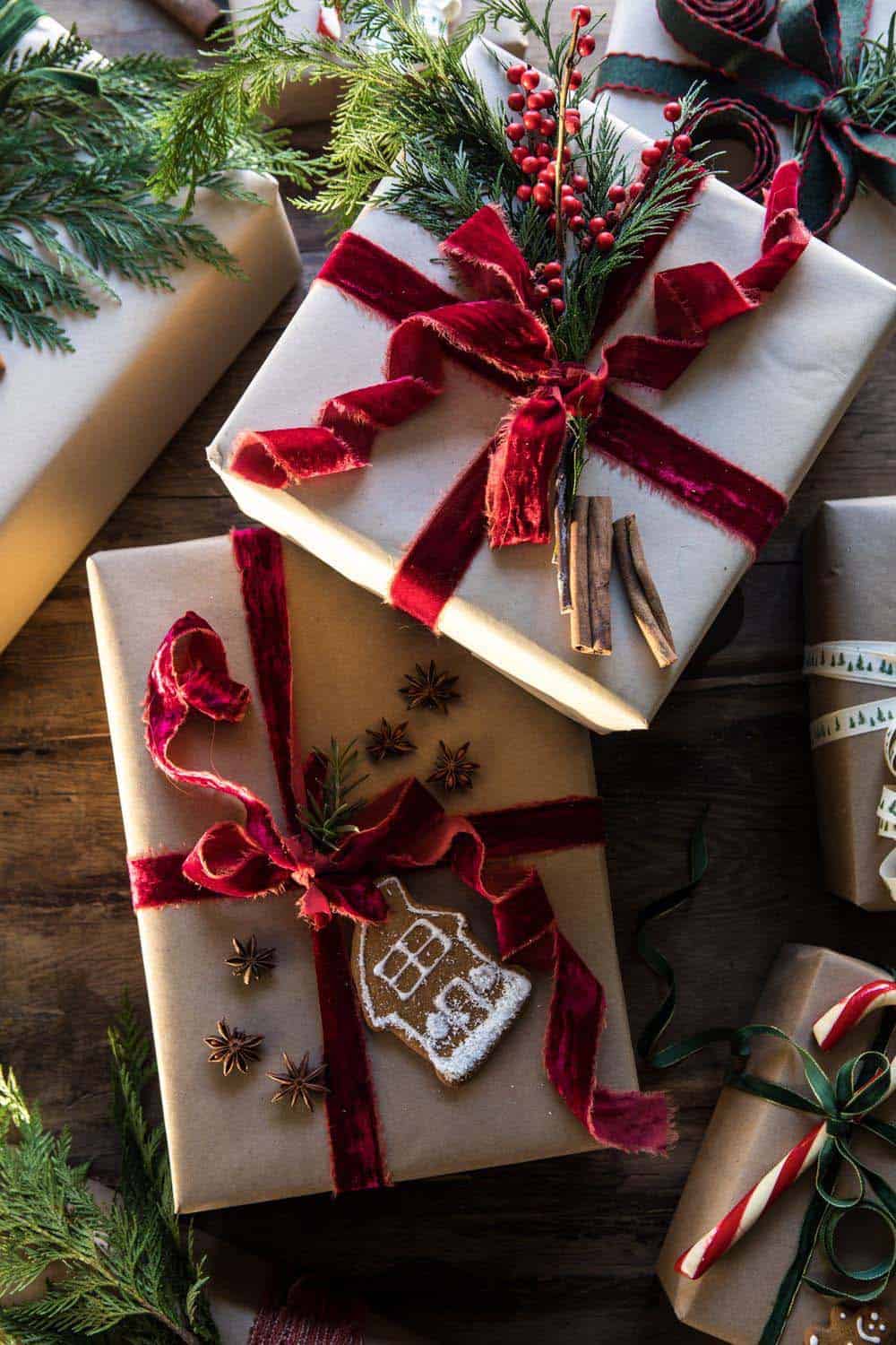 christmas gifts wrapped with brown Kraft paper and red ribbons