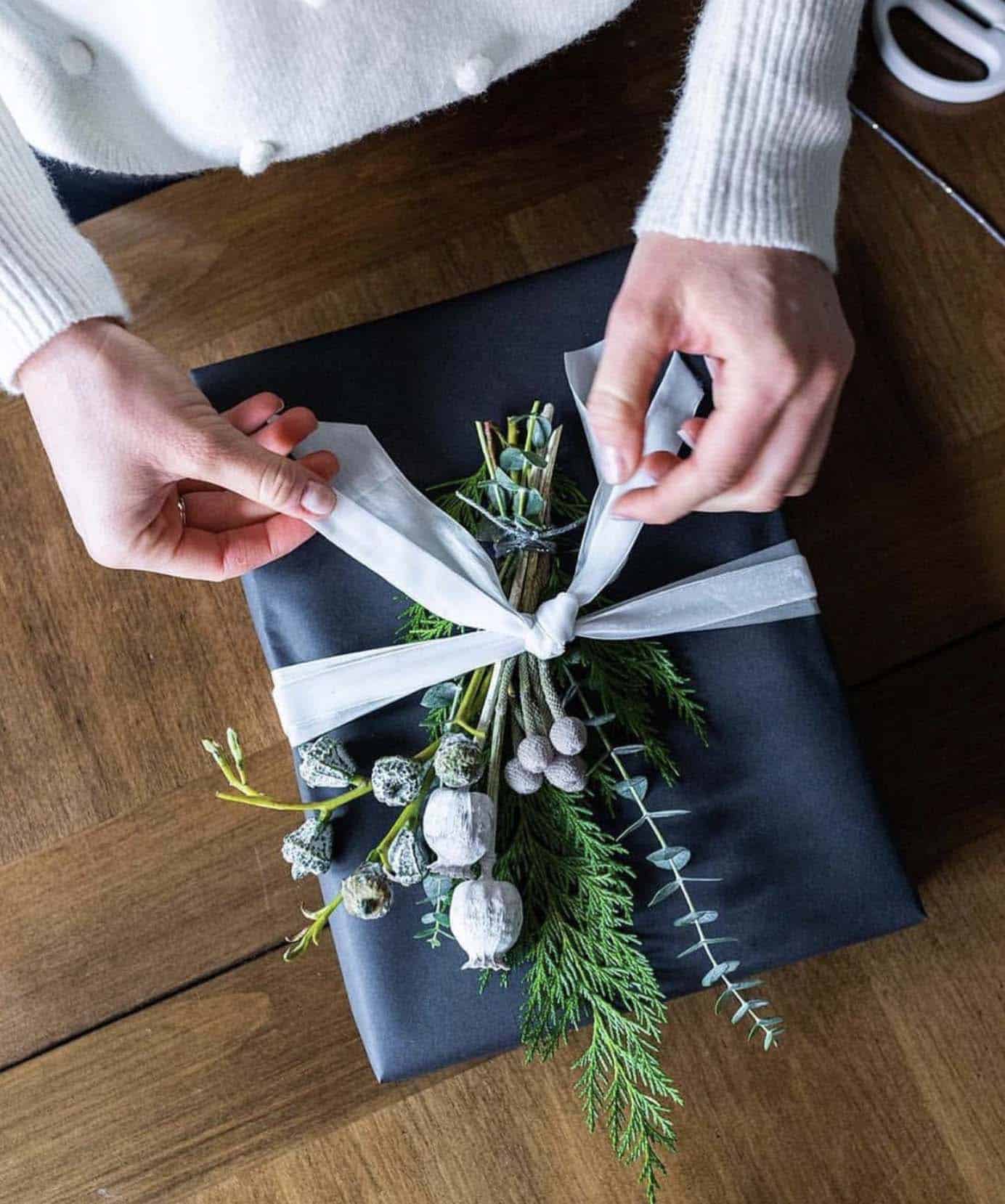 christmas presents with fresh greenery