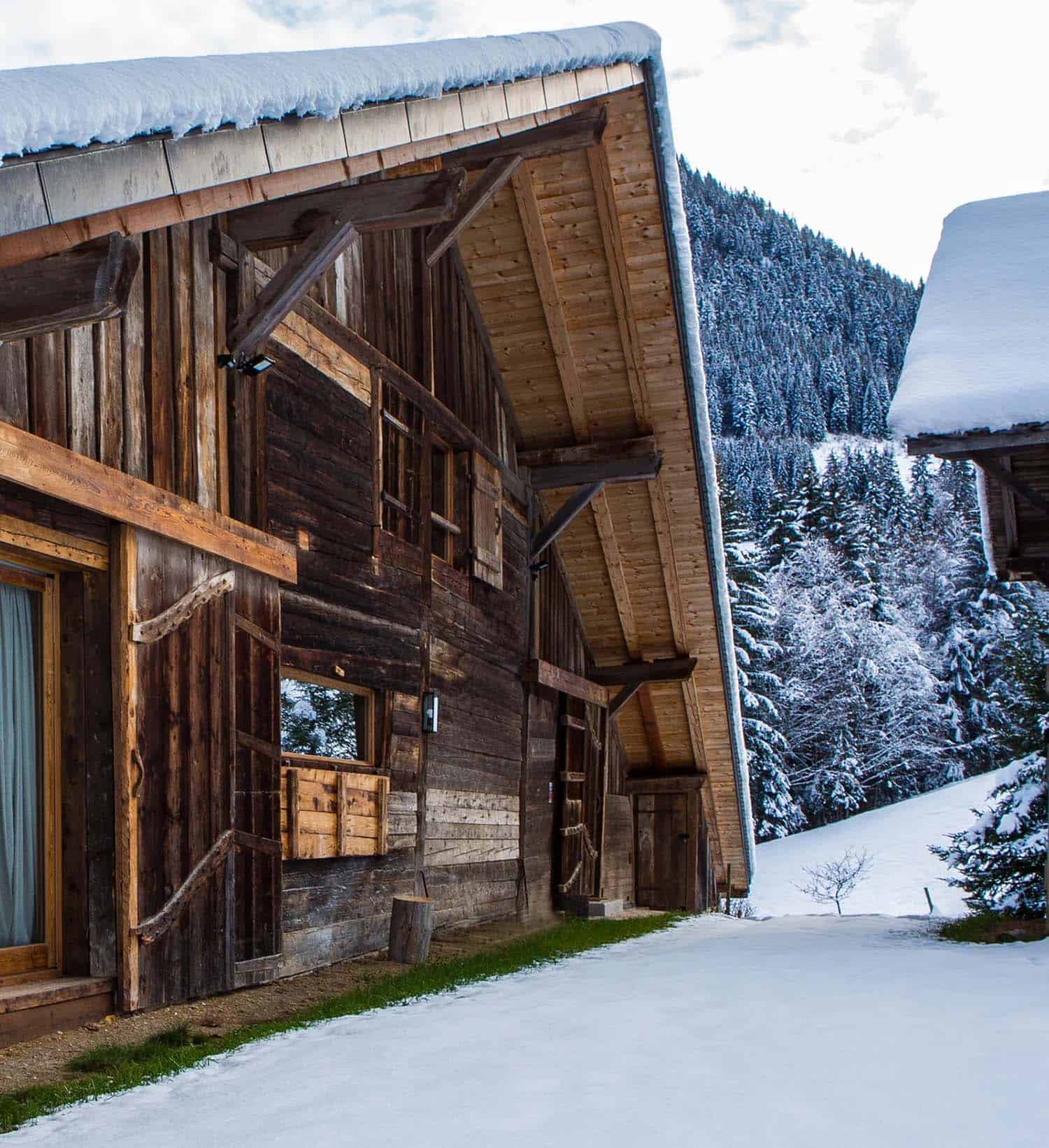 rustic mountain house exterior with snow
