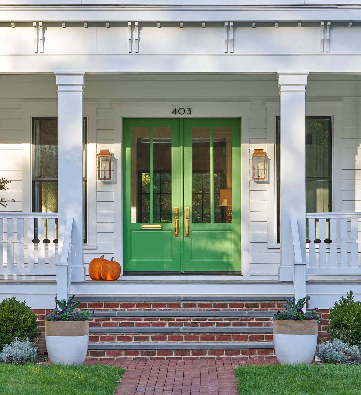 Italianate bungalow entry with green doors
