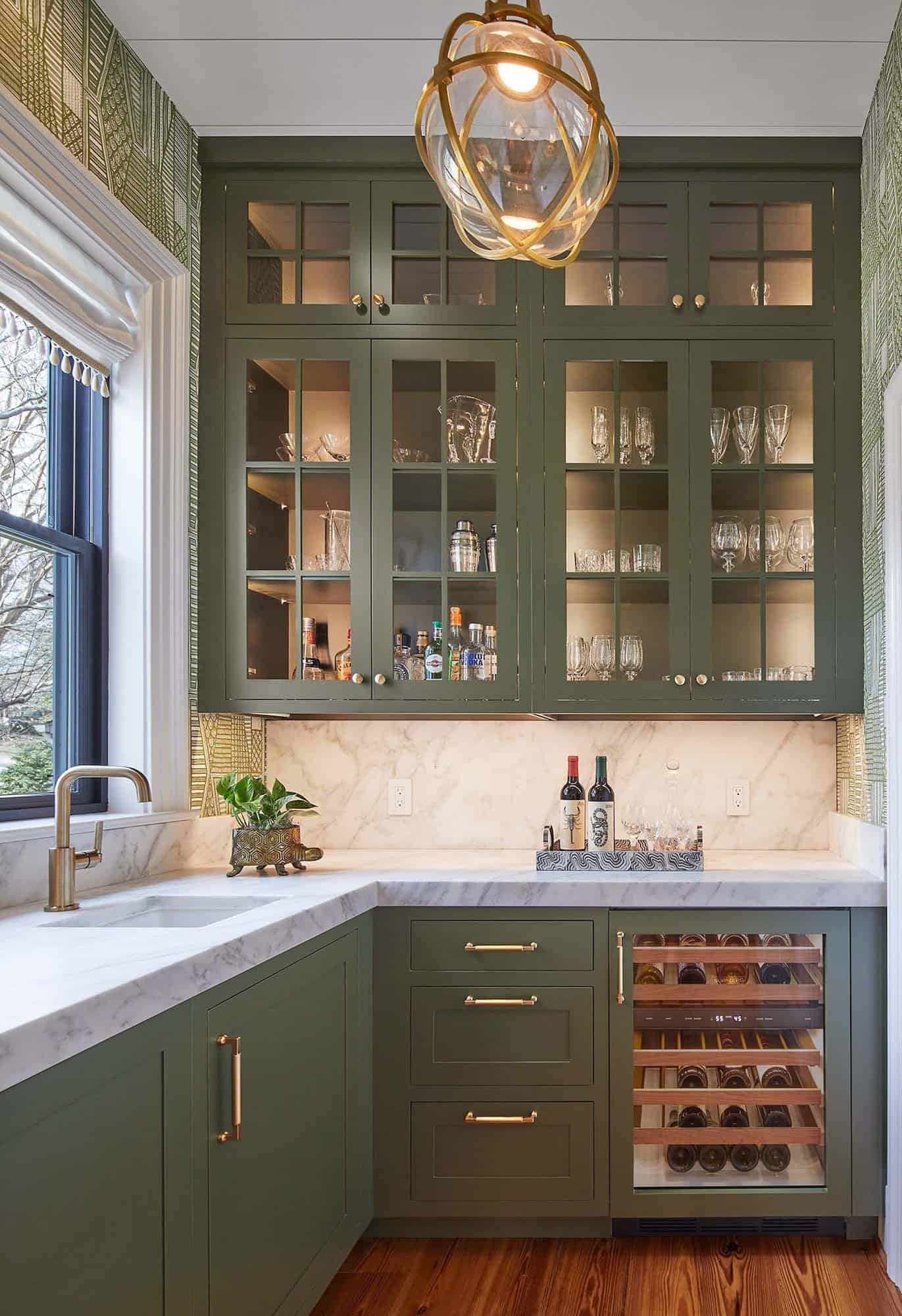 contemporary kitchen pantry with green cabinets