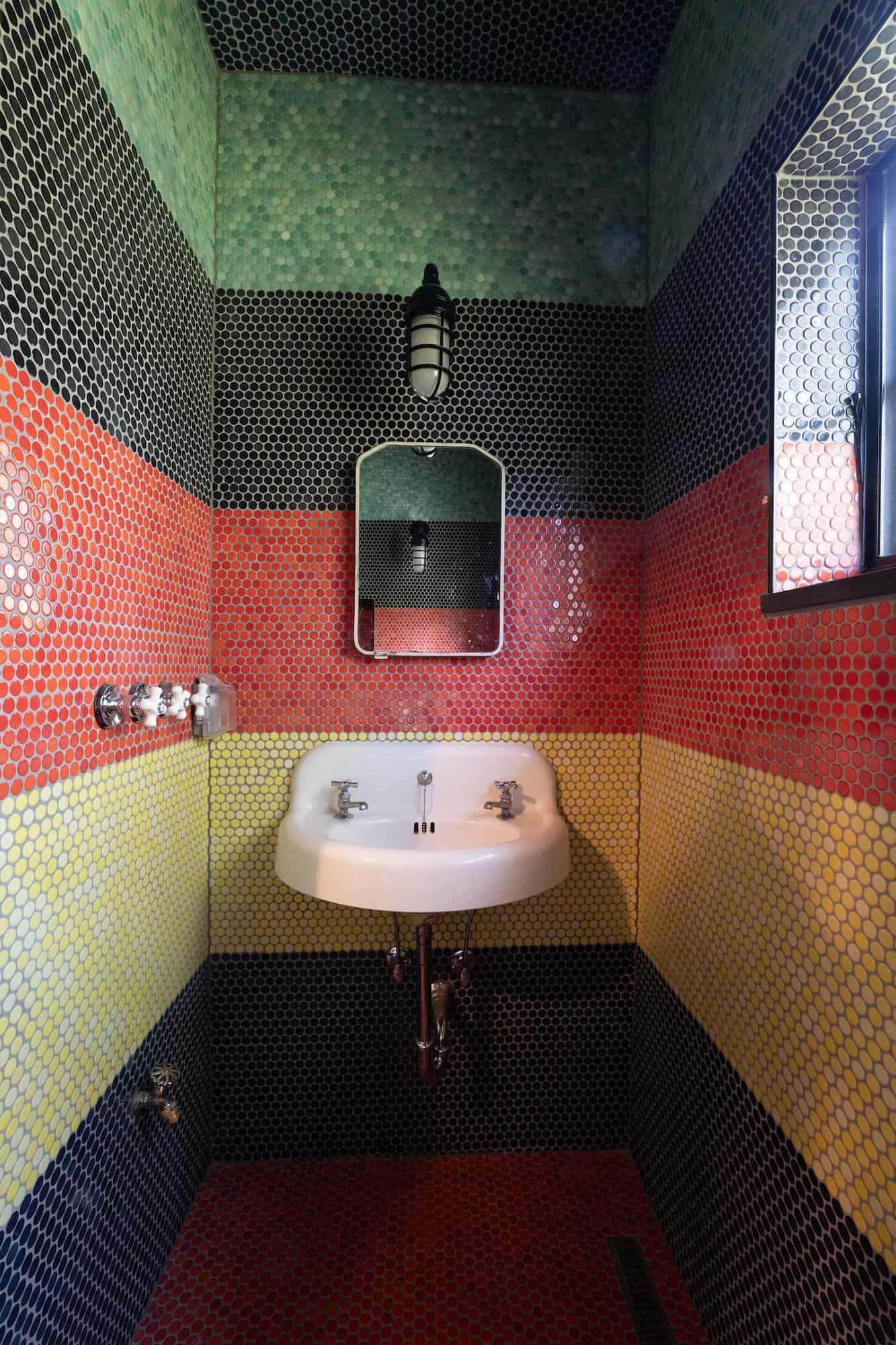 contemporary powder room with colorful wall tile