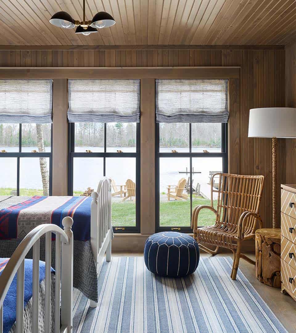 rustic guest bedroom with views of the lake