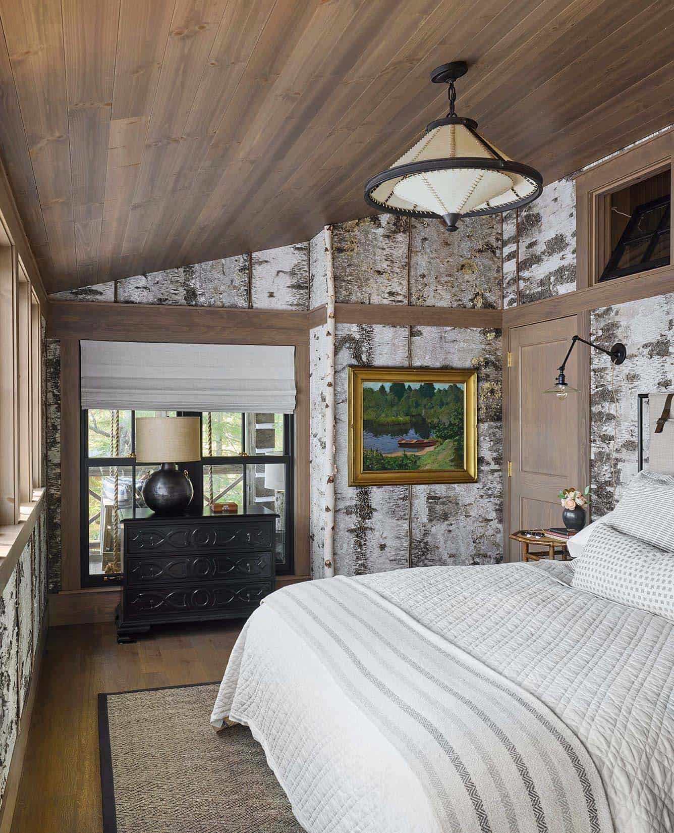 rustic bedroom with a birch panel wall