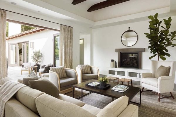 mediterranean style living room with a fireplace and indoor-outdoor connection