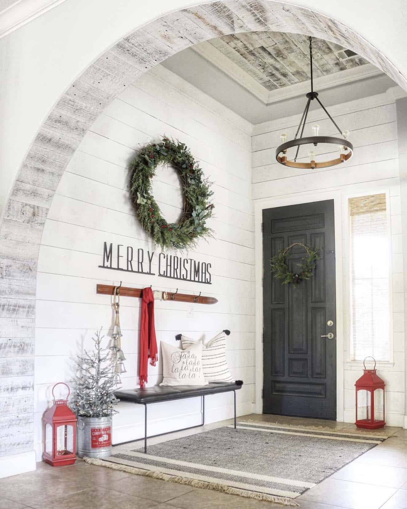 large christmas wreath on the wall in the front entry
