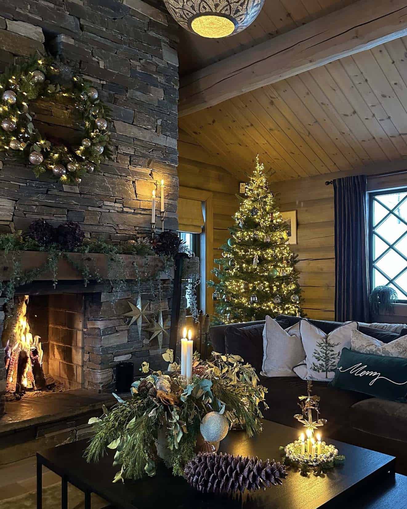 magical christmas atmosphere in the living room with a fireplace and tree