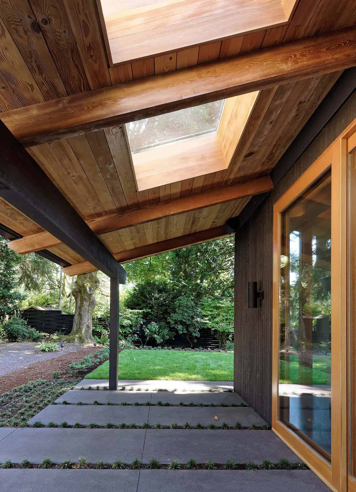mid-century modern home covered porch with a skylight