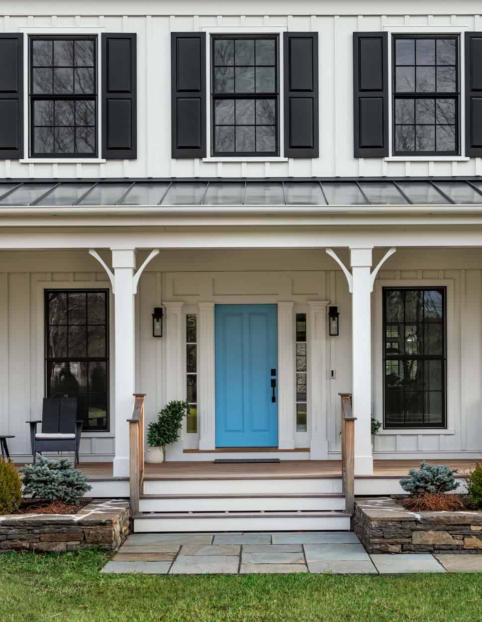 modern farmhouse exterior with a blue door