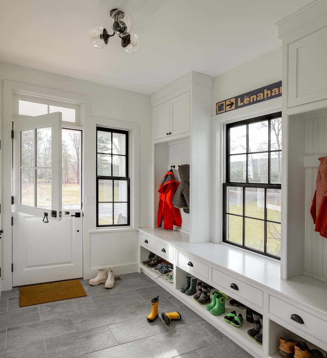 modern farmhouse mudroom with a back door entry