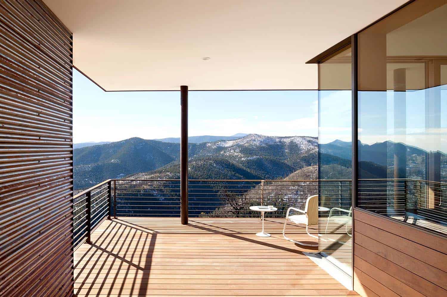 modern hillside home exterior wrap-around deck