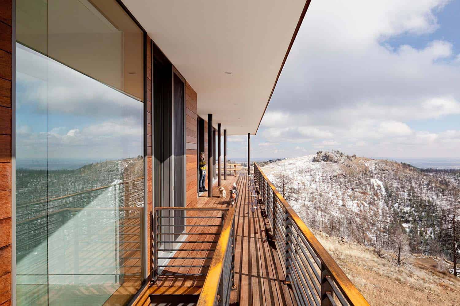 modern hillside home exterior wraparound deck