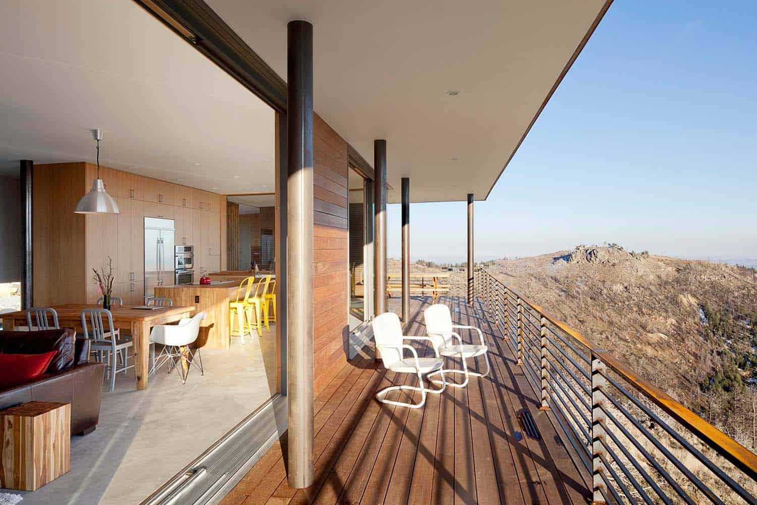 modern hillside home exterior wraparound deck