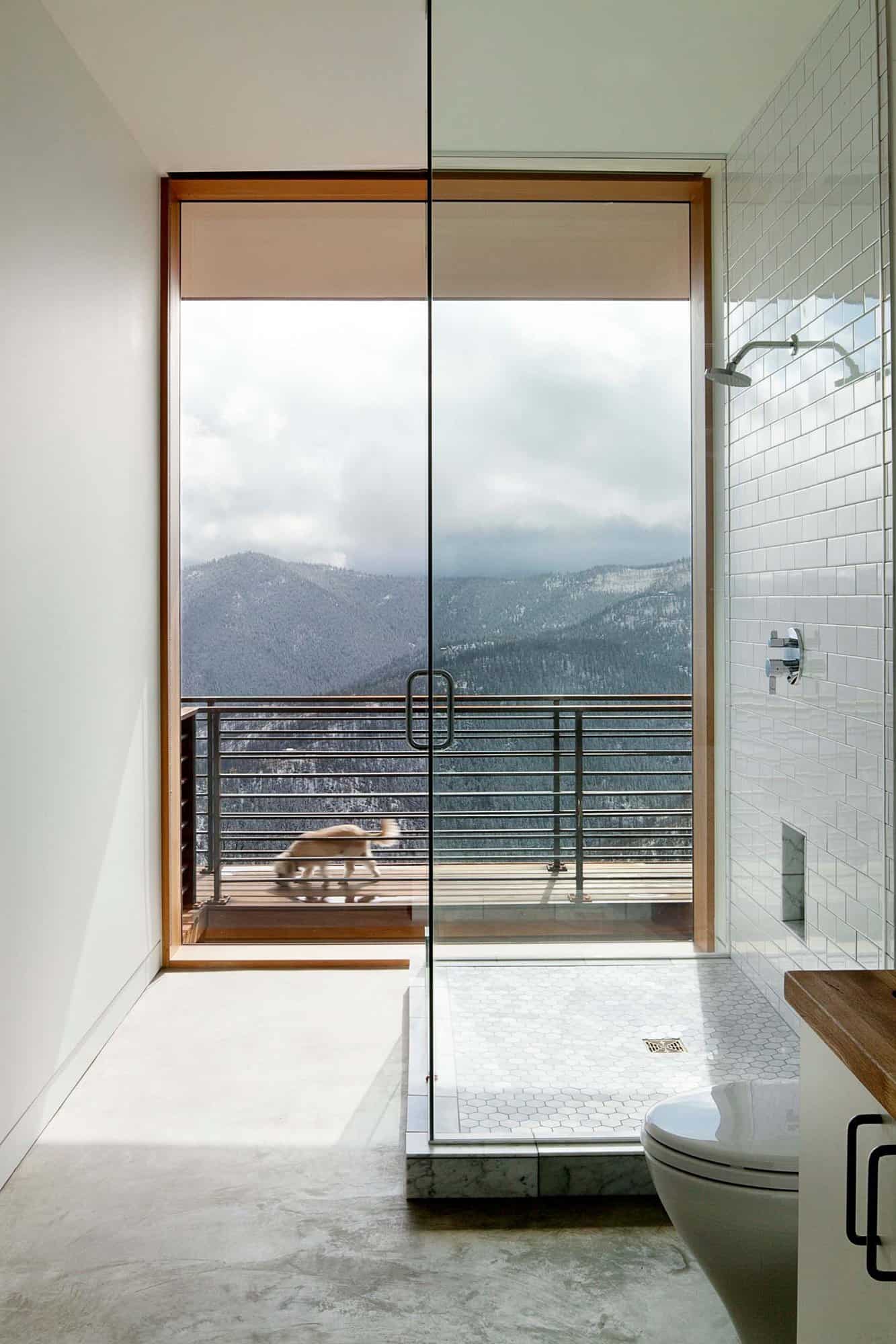 modern bathroom with a shower and large window view