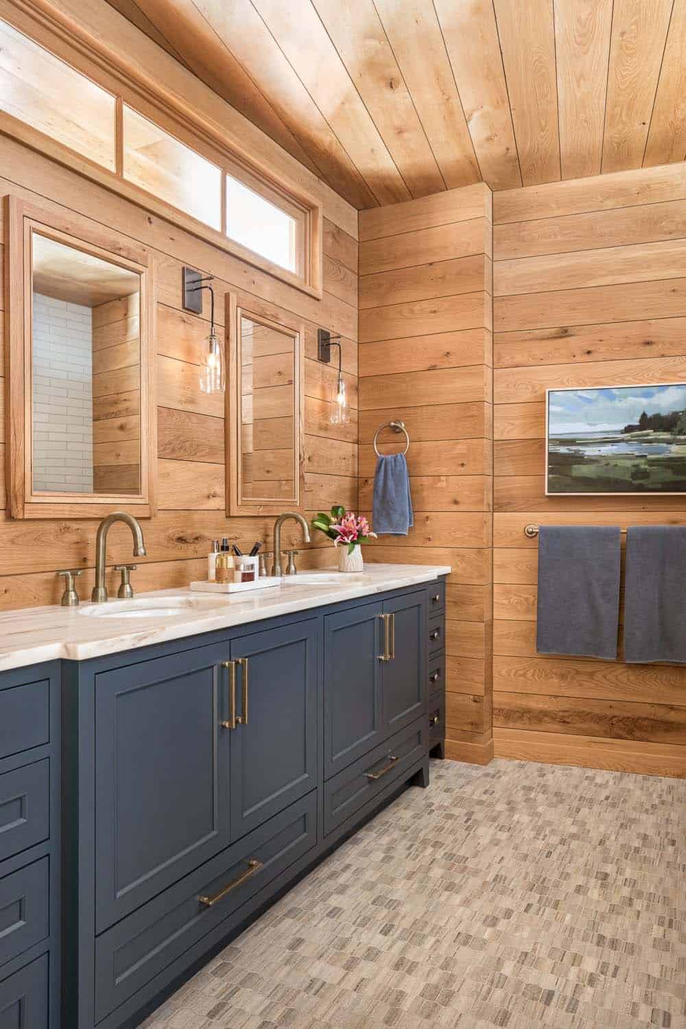 modern rustic bathroom with blue cabinets