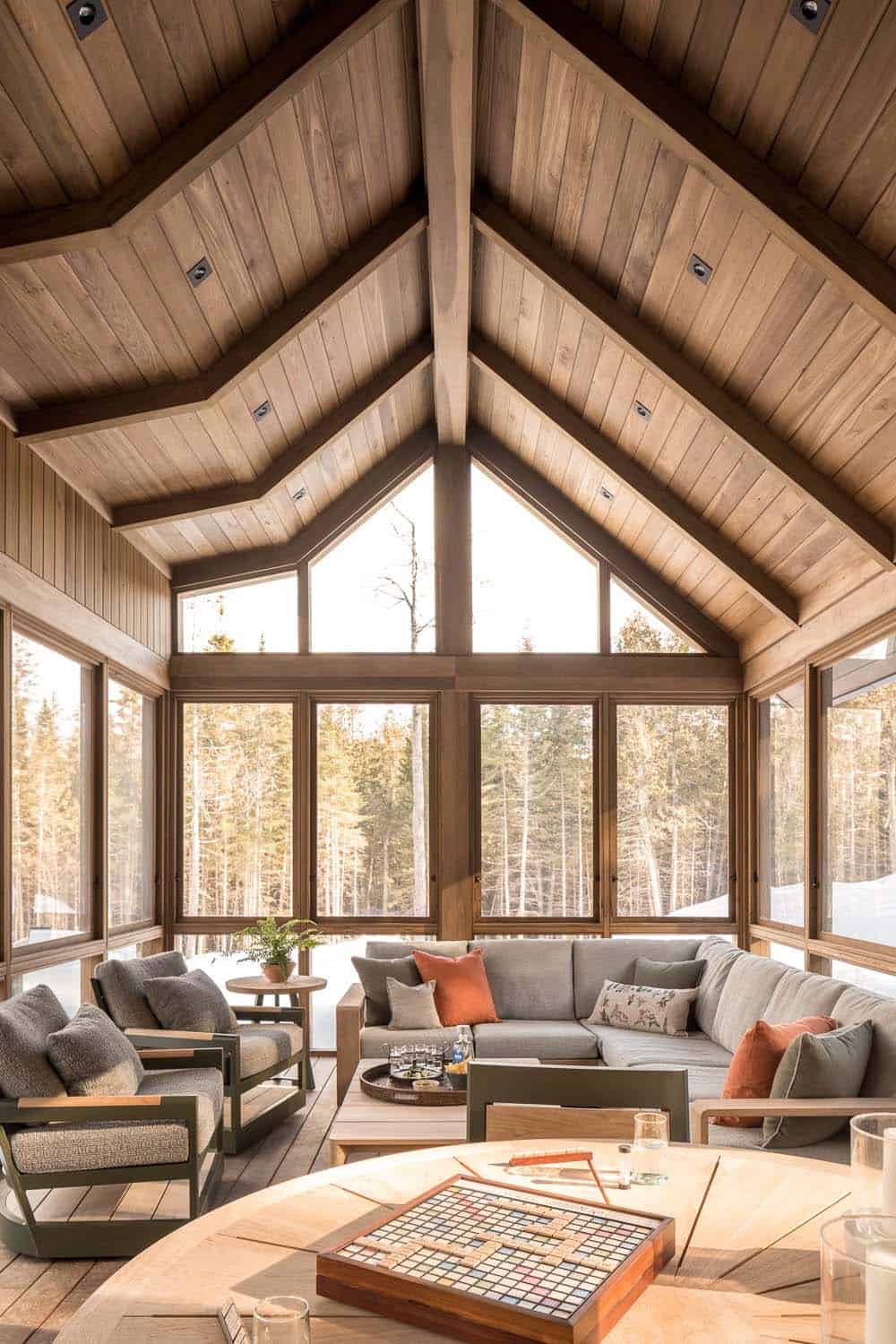 rustic screened porch with a tall ceiling