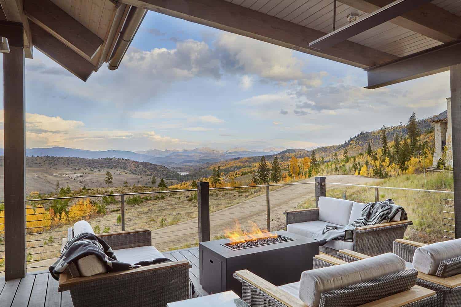 contemporary mountain home outdoor deck with a fire pit