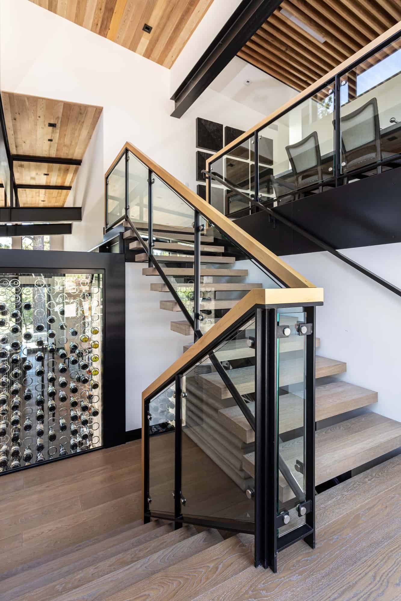 modern staircase with a view of the wine cellar