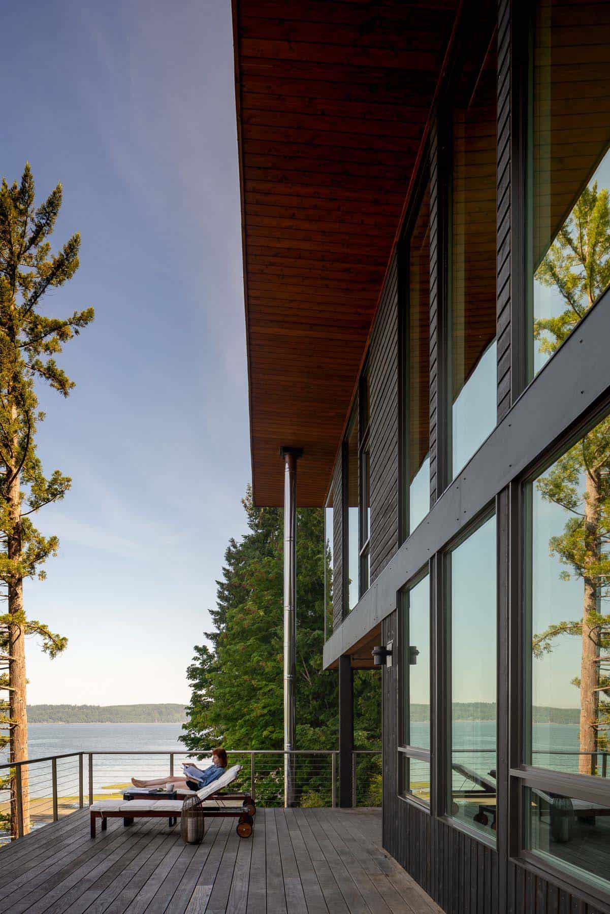 modern beach house exterior deck overlooking the water