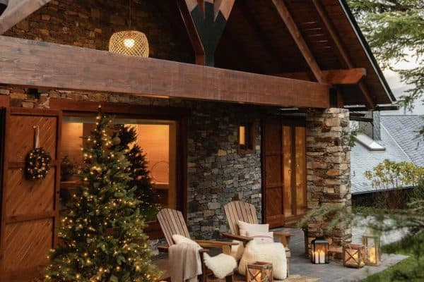rustic cabin exterior with christmas trees