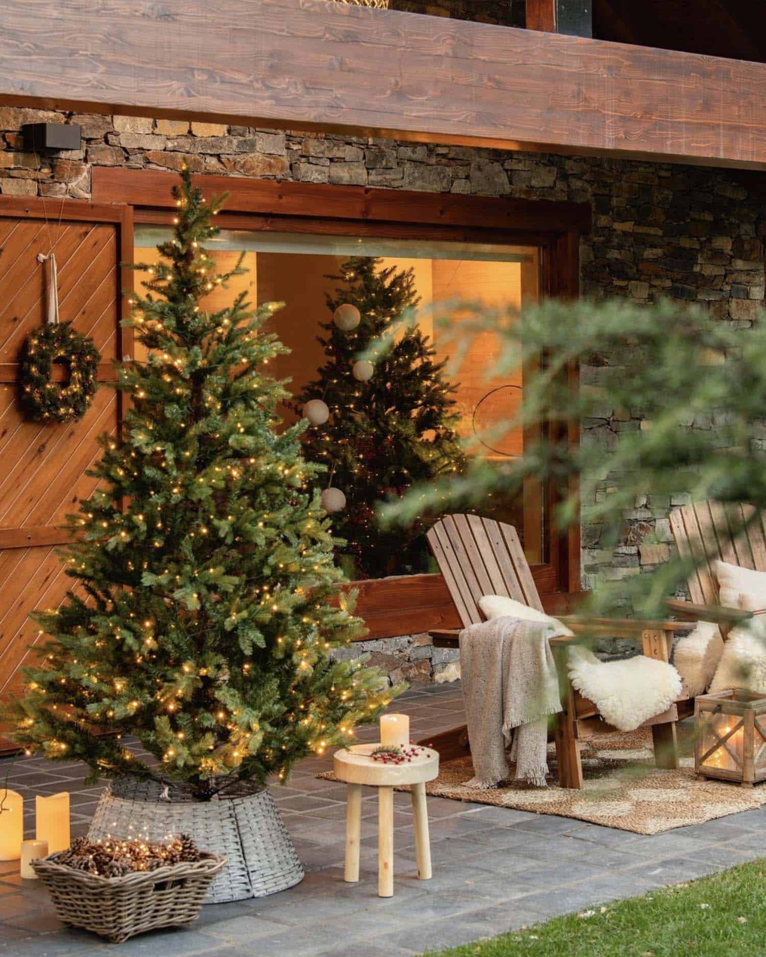 rustic cabin exterior front porch with christmas trees