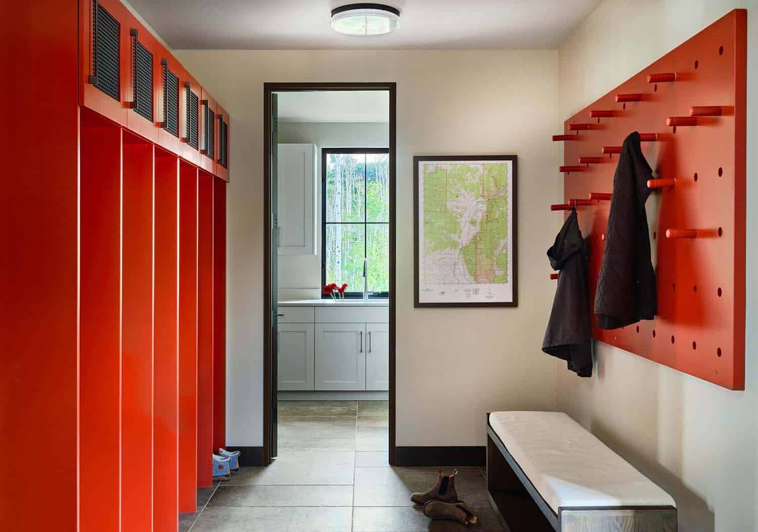 modern mudroom with storage lockers and a jacket hanging wall