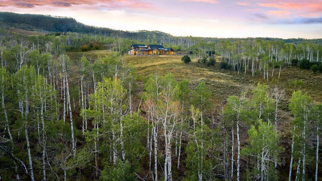 rustic mountain home exterior aerial view
