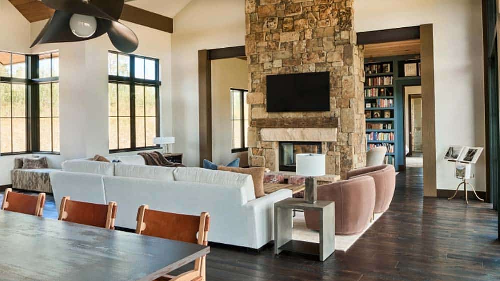 modern rustic living room with a dual-sided fireplace