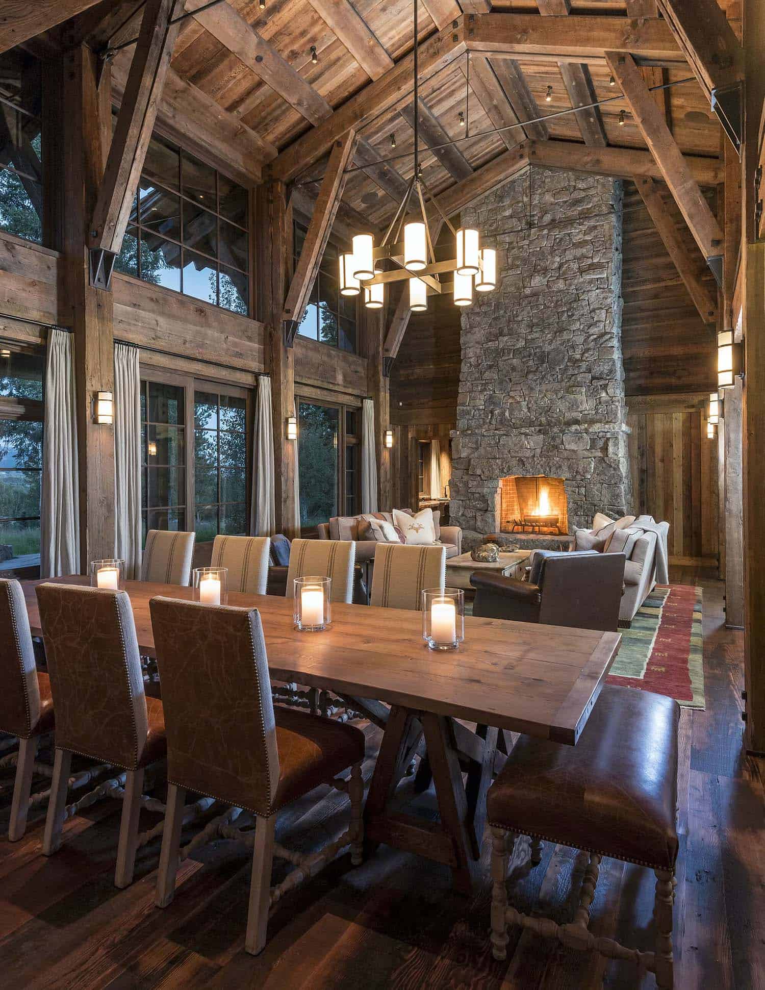 rustic dining and living room with a fireplace