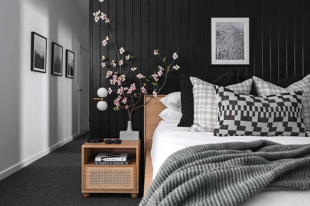 Scandinavian style bedroom with a black accent wall