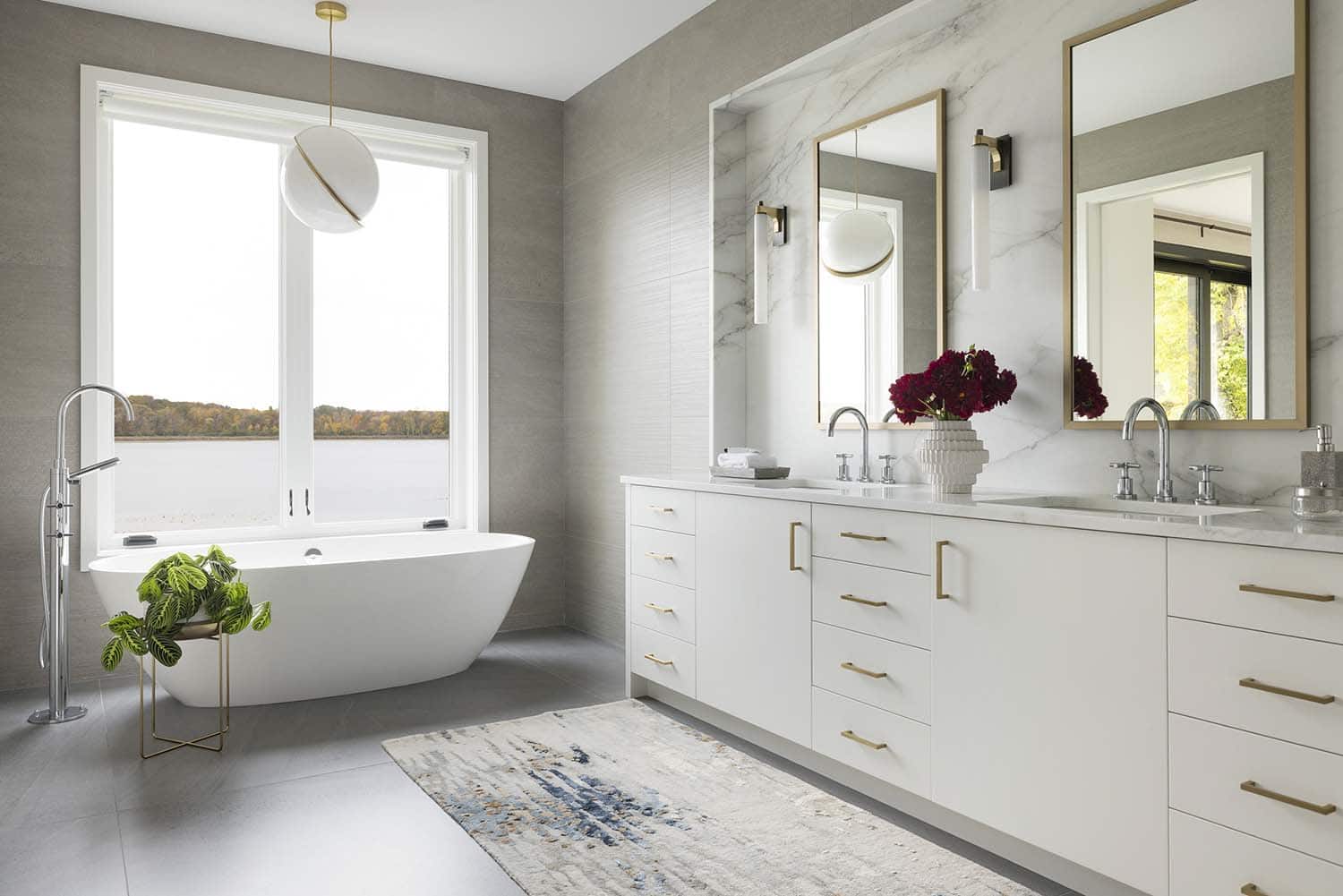 Scandinavian midcentury modern bathroom with a vanity and freestanding tub