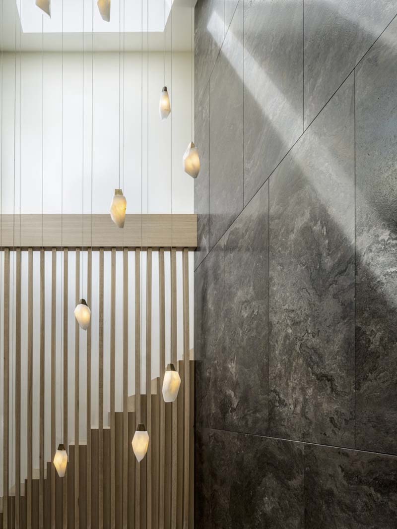 modern staircase with suspended lights
