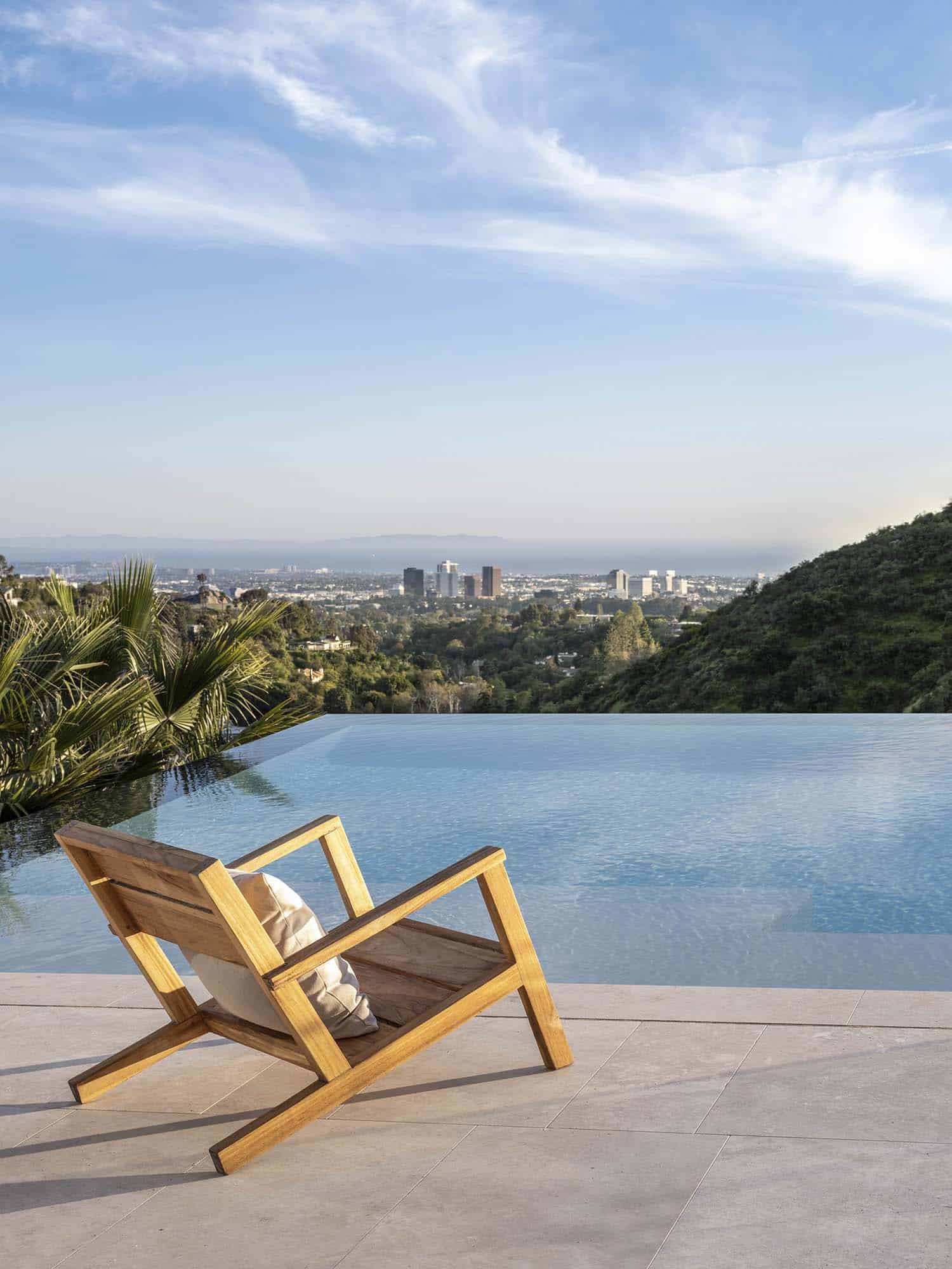 modern swimming pool with a view of the Los Angeles skyline