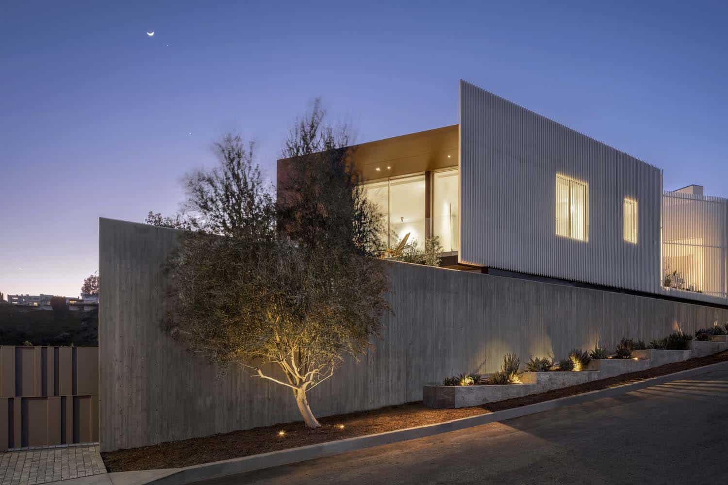 modern concrete home exterior at dusk
