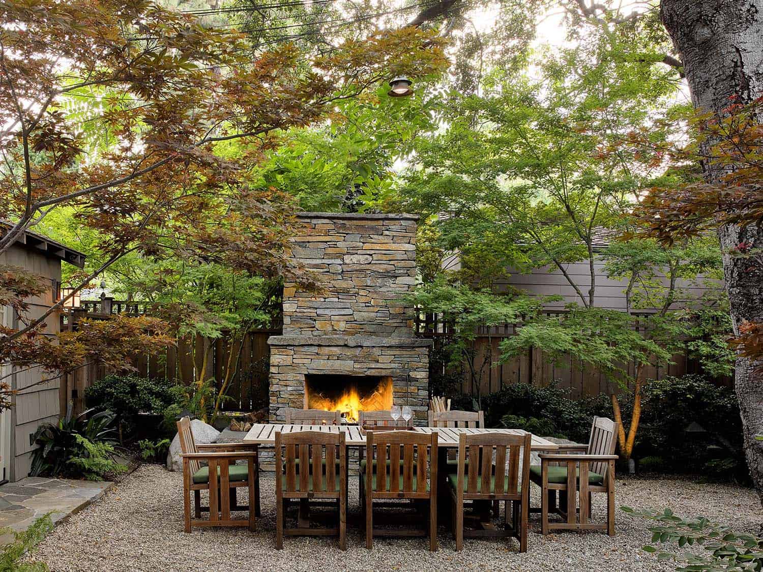 traditional outdoor fireplace with outdoor dining furniture