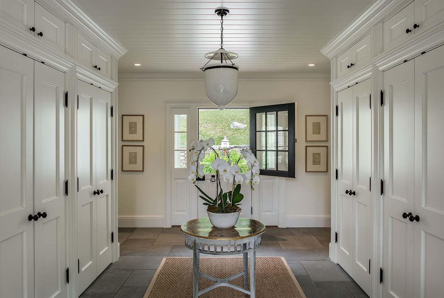 transitional style mudroom entry with a Dutch door