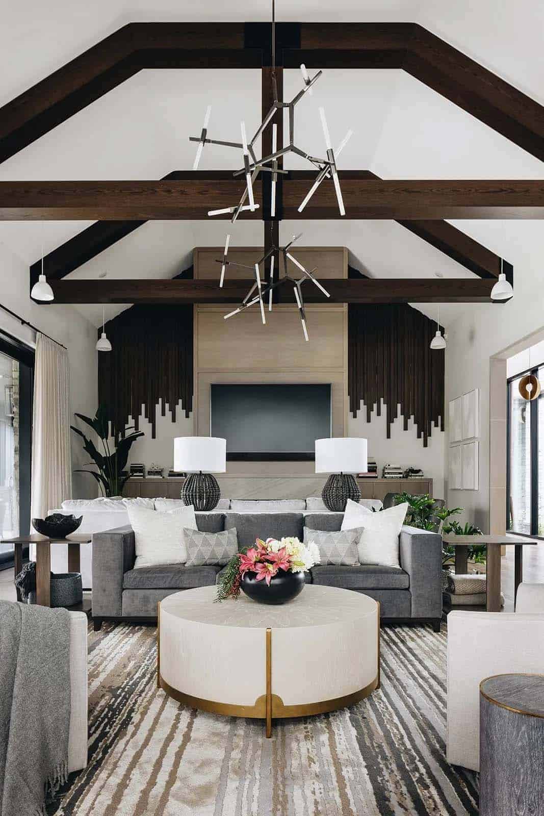 transitional style living room with ceiling trusses