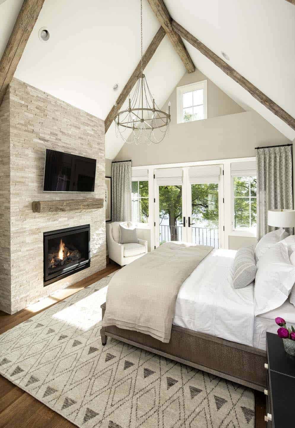 contemporary casual bedroom with a fireplace