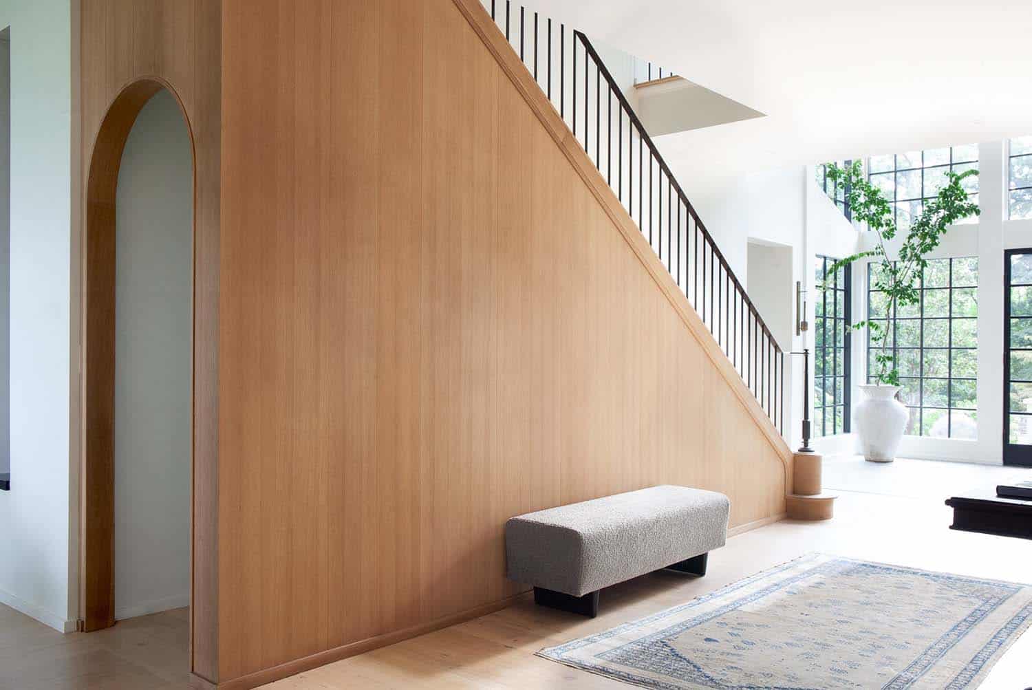 contemporary staircase with a bench
