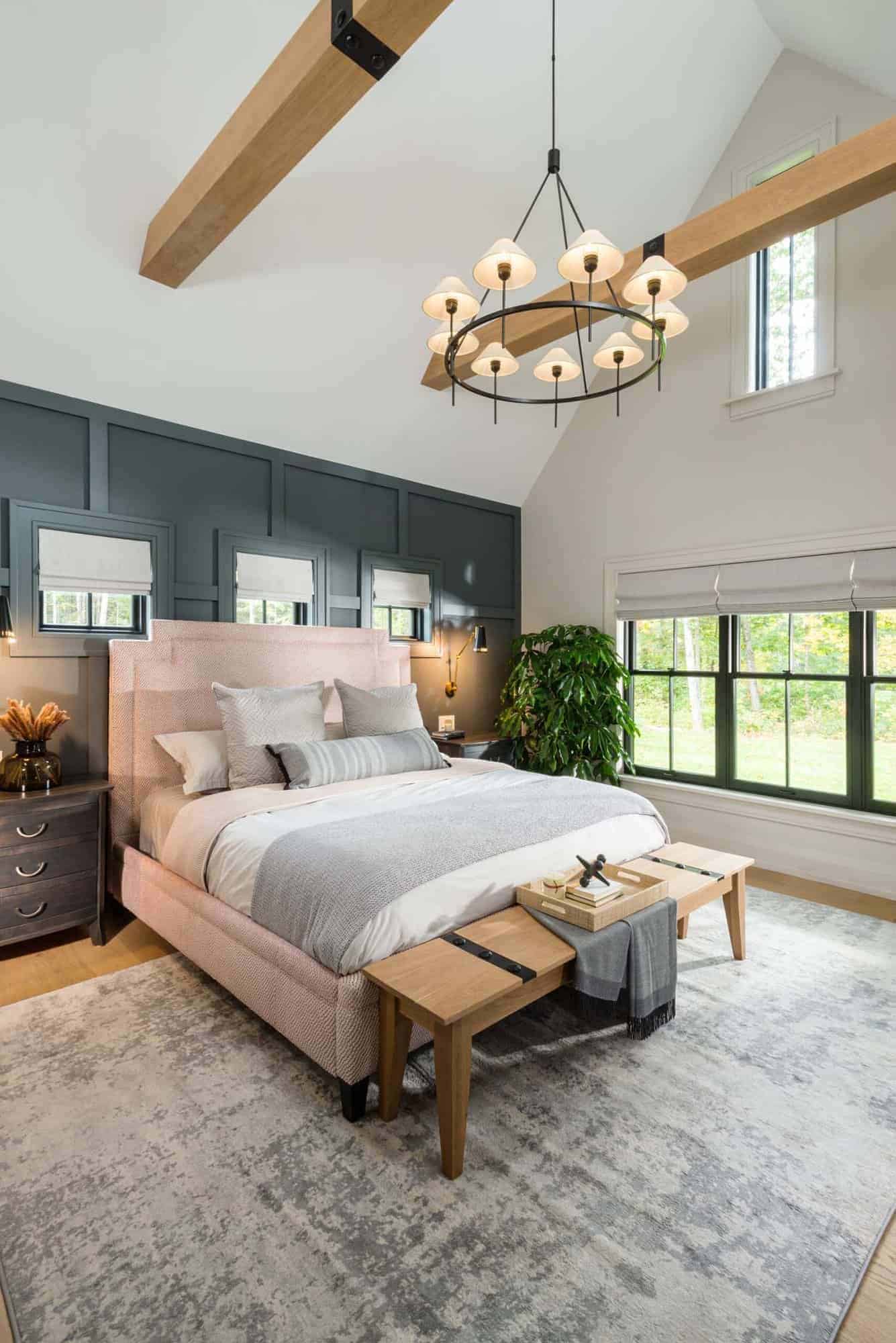contemporary bedroom with a vaulted wood beam ceiling