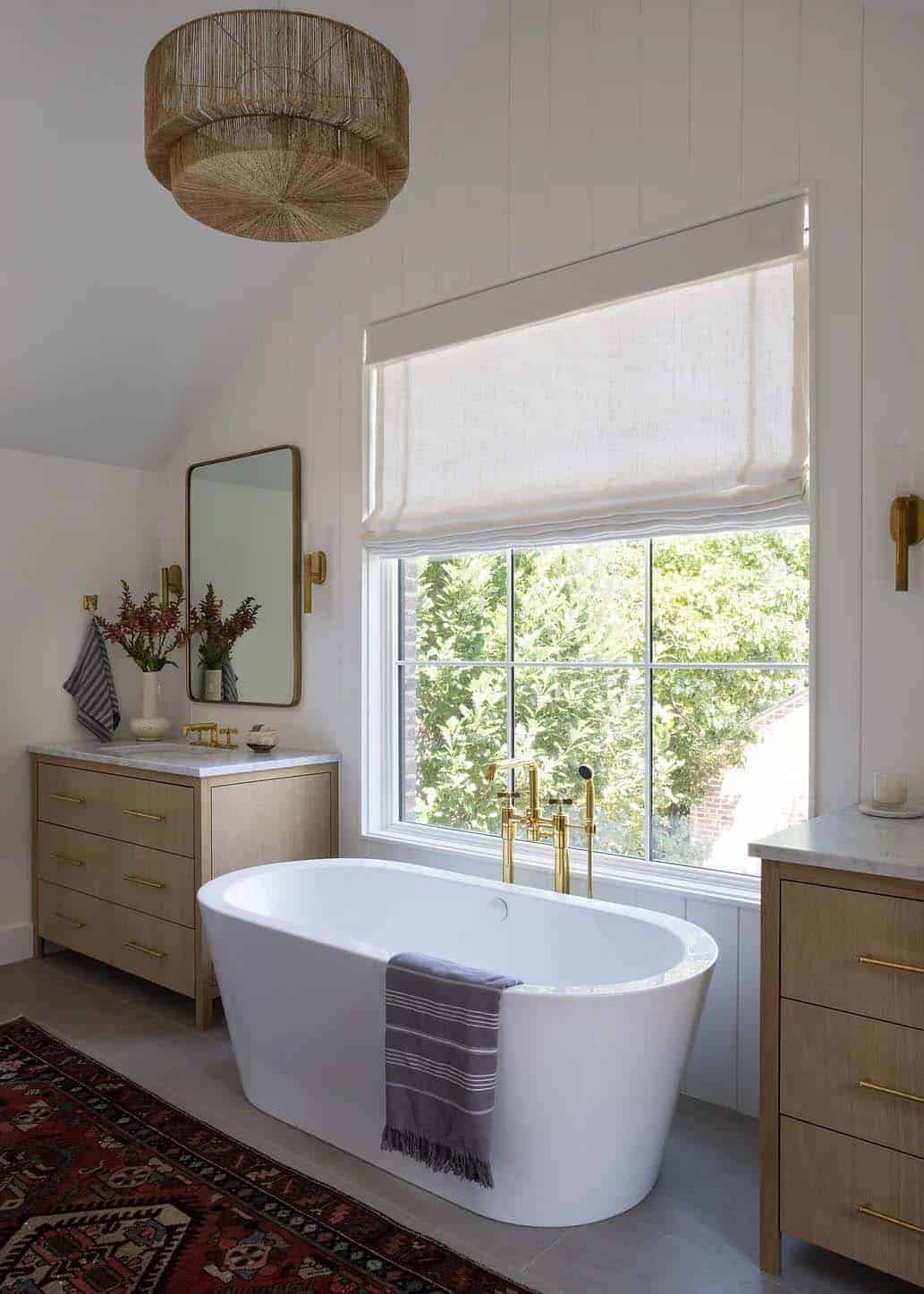 contemporary bathroom with dual vanities and a freestanding tub