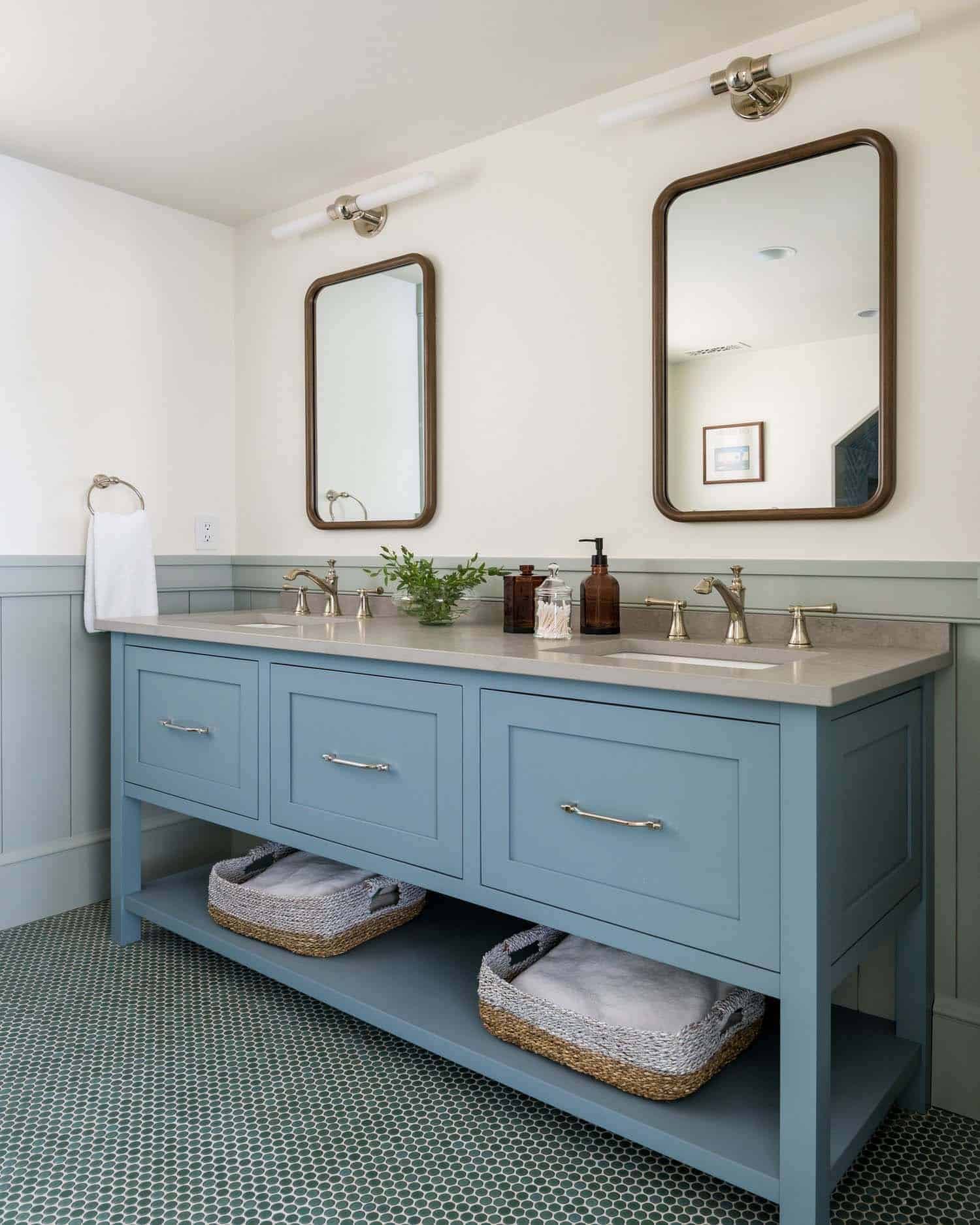 contemporary bathroom vanity painted blue with two mirrors