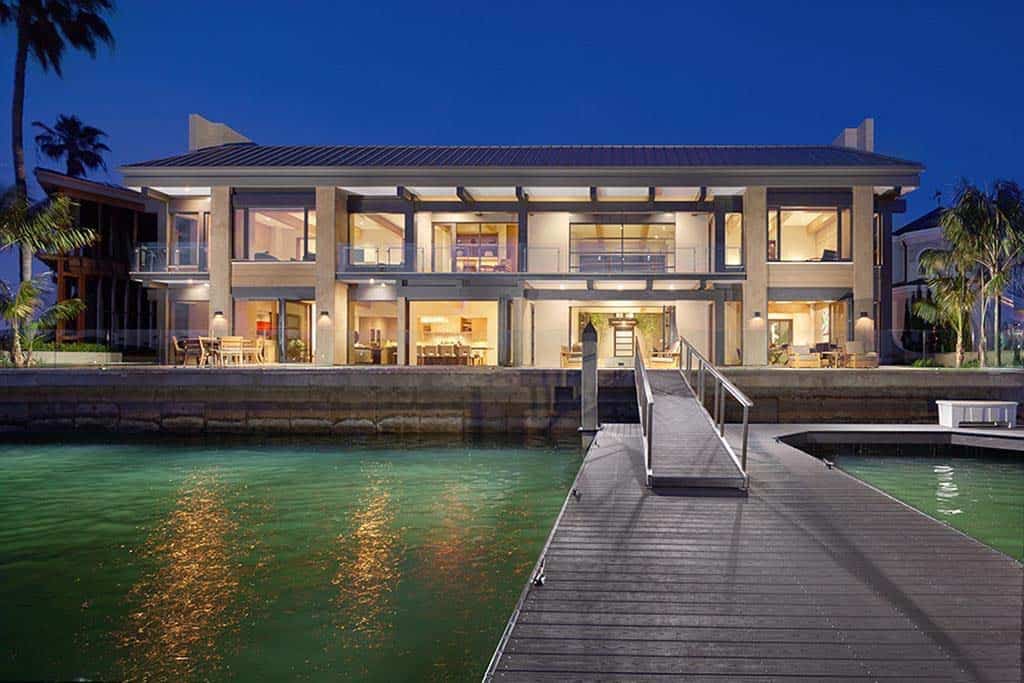 contemporary waterfront home exterior at dusk
