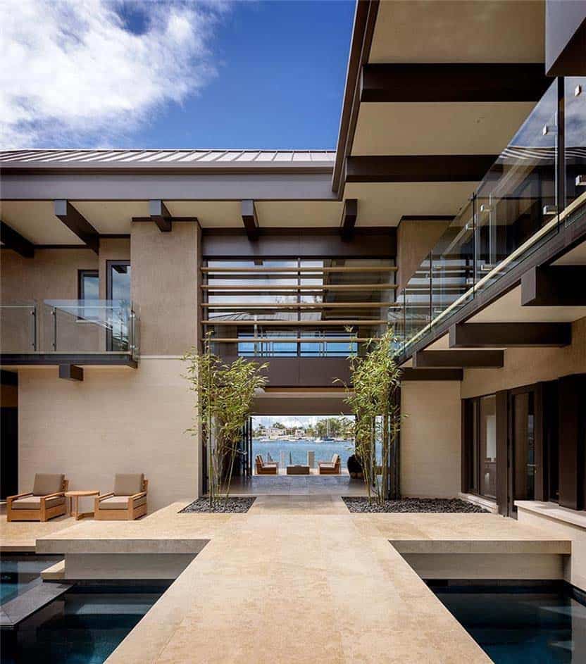 contemporary waterfront home exterior with water features