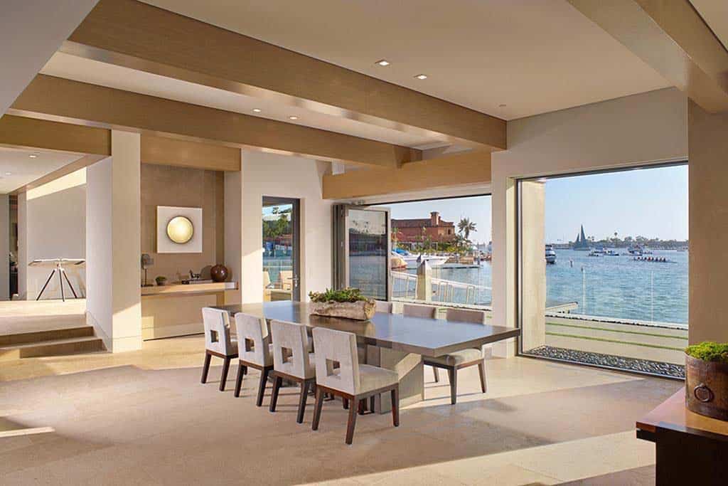 contemporary dining room with a water view